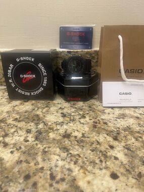 Casio G-Shock Warranty Card in Black and Red